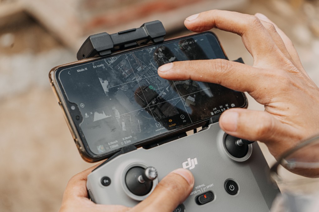 Remote controller with a phone mounted on it