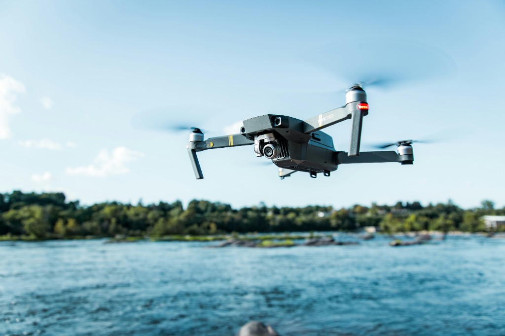 Drone flying over open water